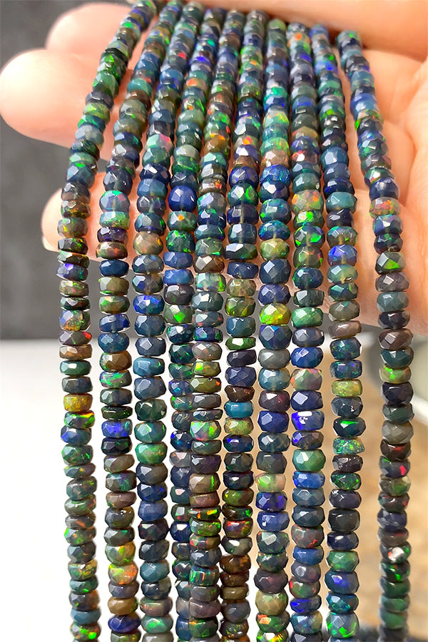 Precious Opal (Button Cut) Black Size: Approx. 2-3.5 x 3-6 mm Hole diameter: Approx. 0.3-0.4 mm