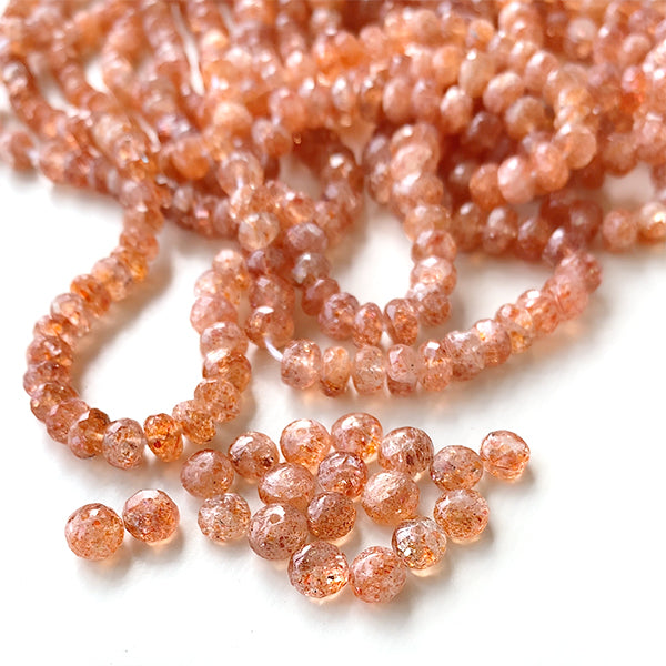 Sunstone (button cut) size about 3~3.5x4~5mm hole diameter about 0.4~0.5mm 10 pieces