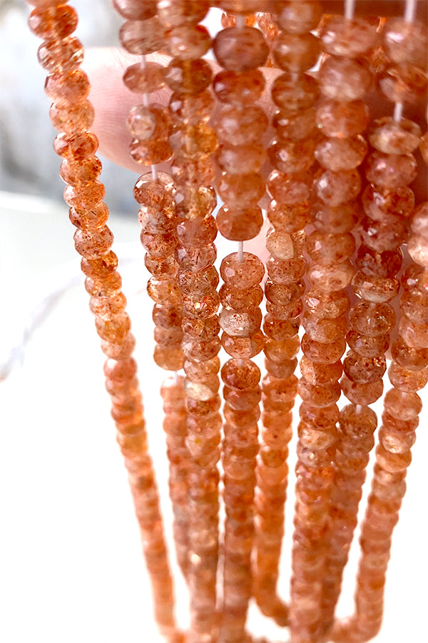 Sunstone (button cut) size about 3~3.5x4~5mm hole diameter about 0.4~0.5mm 10 pieces