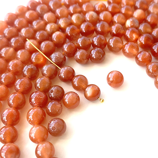 Sunstone (round plane) size about 5.5-6mm hole diameter about 0.6-0.7mm