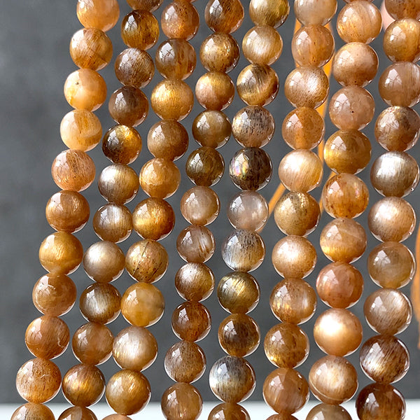 Moonstone (Round Plain) Brown Size: Approx. 6mm Hole diameter: Approx. 0.4-0.5mm