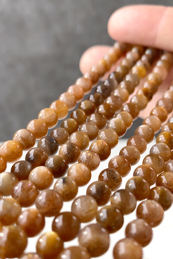 Moonstone (Round Plain) Brown Size: Approx. 6mm Hole diameter: Approx. 0.4-0.5mm