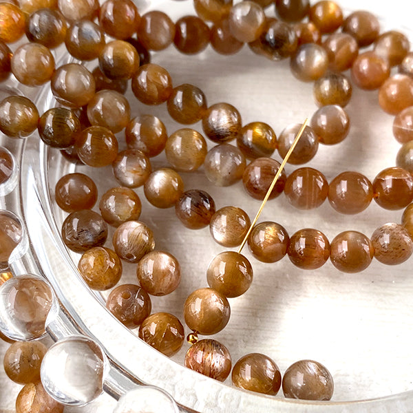 Moonstone (Round Plain) Brown Size: Approx. 6mm Hole diameter: Approx. 0.4-0.5mm