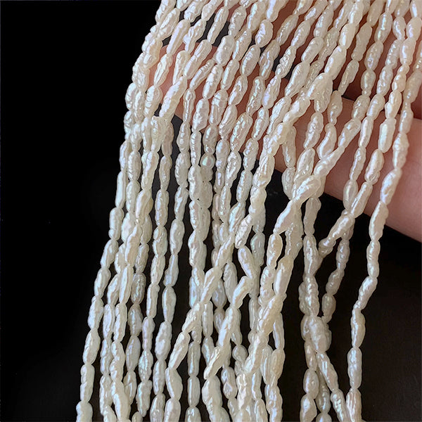 【淡水パール】 (ライス ライスバロック ロングライス) 大きさ 約5~7.5×2~2.3mm 穴径 約0.5mm 約62~65個 約35cm