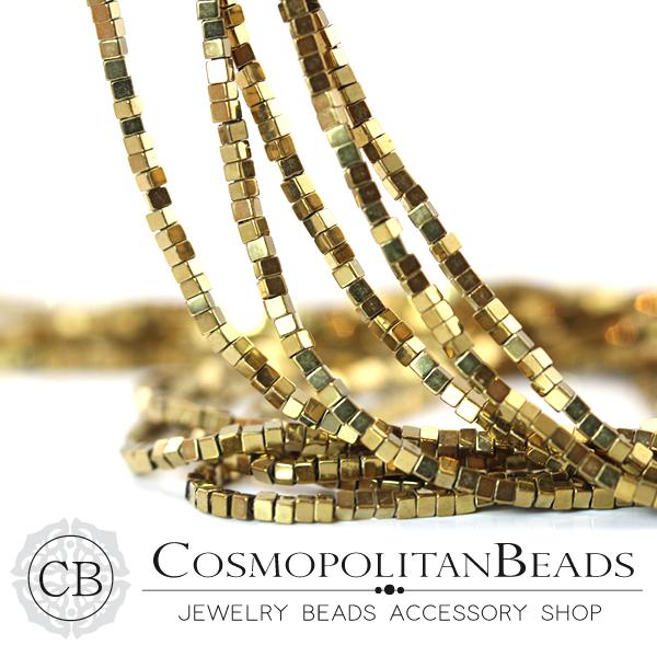 Hematite (cube square cut) Color light gold Size approx. 1.0 x 1.4 mm Hole diameter approx. 0.5 mm