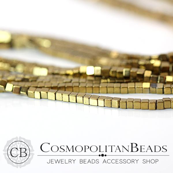 Hematite (cube square cut) Color light gold Size approx. 1.0 x 1.4 mm Hole diameter approx. 0.5 mm