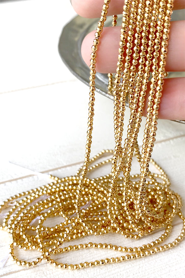 Hematite (Round Cut) Gold Size: Approx. 2 x 2.3 mm Hole diameter: Approx. 0.6 mm