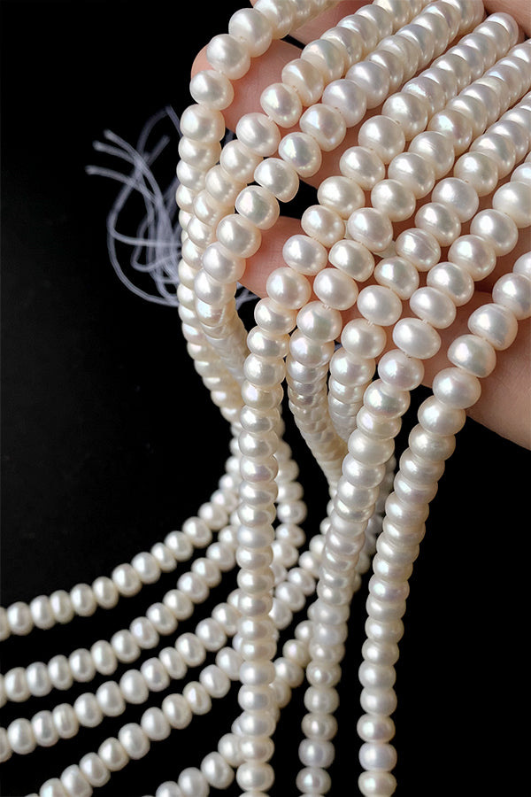 Freshwater pearl (button) Size: approx. 3-5 x 6.3-6.5mm Hole diameter: approx. 0.4-0.5mm 