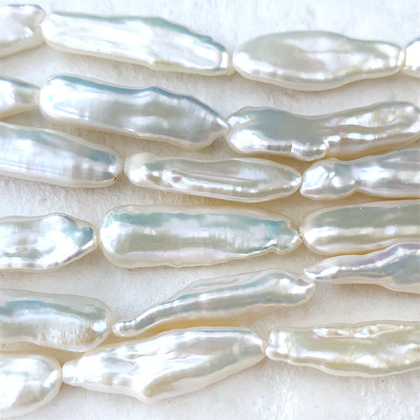 Freshwater pearl (loquat stick) Size: Approx. 22-25 x 7-8.5 mm Hole diameter: Approx. 0.4-0.5 mm 