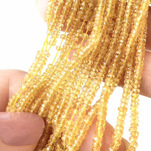 【天然石】 イエローサファイヤ （ボタンカット） 大きさ　約1～1.4×2～3mm 穴径　約0.3～0.4mm