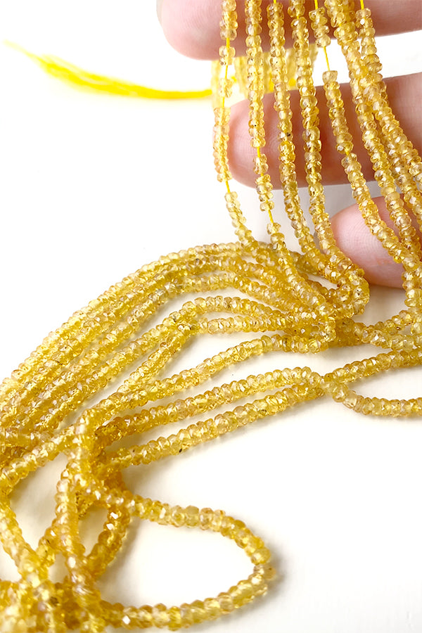 【天然石】 イエローサファイヤ （ボタンカット） 大きさ　約1～1.4×2～3mm 穴径　約0.3～0.4mm