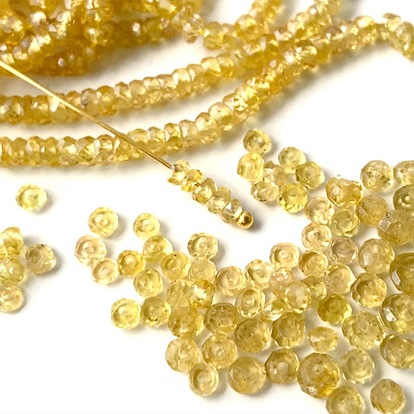 【天然石】 イエローサファイヤ （ボタンカット） 大きさ　約1～1.4×2～3mm 穴径　約0.3～0.4mm