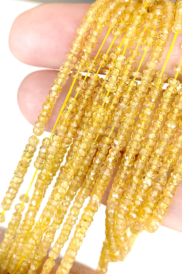 【天然石】 イエローサファイヤ （ボタンカット） 大きさ　約1～1.4×2～3mm 穴径　約0.3～0.4mm