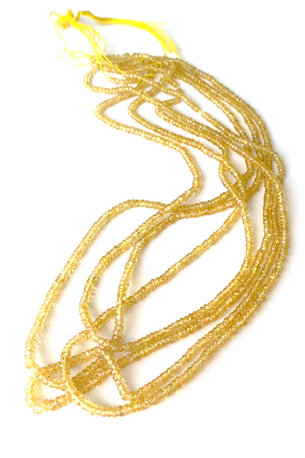 【天然石】 イエローサファイヤ （ボタンカット） 大きさ　約1～1.4×2～3mm 穴径　約0.3～0.4mm