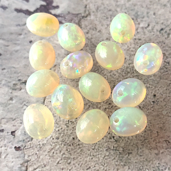 Precious Opal (Oval Plain Cabochon) Size: Approx. 8 x 10mm Hole Diameter: Approx. 0.7~0.8mm 1 piece