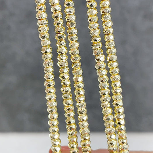 ヘマタイト （ボタンカット） ライトゴールド 大きさ　約2×3mm 穴径　約0.4～0.5mm